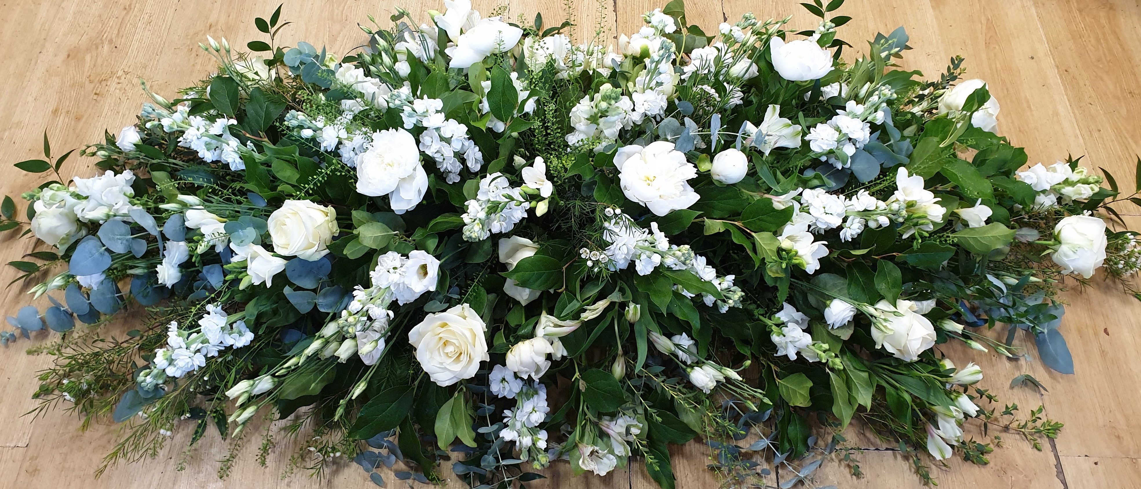 White and garden-green floral spray hand-tied in the Blossom Flowers studio